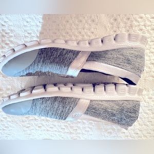 Skechers. Size 6.5. Never worn. Satin trim.